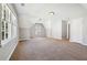 Large bonus room features carpet, multiple windows for natural light and a door to another room at 4271 Weston Sw Dr, Lilburn, GA 30047