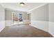Bright dining room with wainscoting and views from a large window at 4271 Weston Sw Dr, Lilburn, GA 30047