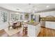 Open eat-in kitchen features stainless steel appliances, granite countertops, and an island at 4271 Weston Sw Dr, Lilburn, GA 30047