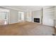 Spacious living room with fireplace and built-in bookshelves at 4271 Weston Sw Dr, Lilburn, GA 30047