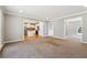 Inviting living room with neutral carpet and open access to kitchen at 4271 Weston Sw Dr, Lilburn, GA 30047