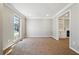 Cozy carpeted room with a large window and decorative moldings at 4271 Weston Sw Dr, Lilburn, GA 30047