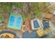 Aerial view showcases the tennis court, swimming pool, driveway, and landscaping at 4800 Silverberry Nw Ln, Acworth, GA 30102