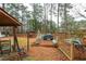 Backyard with deck, grill, gazebo, rocking chair and wood fence at 4800 Silverberry Nw Ln, Acworth, GA 30102