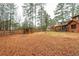 Expansive backyard featuring a gazebo, surrounded by mature trees and greenery at 4800 Silverberry Nw Ln, Acworth, GA 30102
