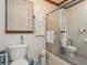 Bathroom featuring a toilet, shower and window at 4800 Silverberry Nw Ln, Acworth, GA 30102