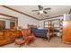 Cozy bedroom with wood furnishings and a ceiling fan at 4800 Silverberry Nw Ln, Acworth, GA 30102