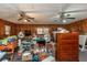 Bonus room with wood paneling, ceiling fans, and various furniture at 4800 Silverberry Nw Ln, Acworth, GA 30102