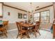 Traditional dining room with a wood table, natural light, and tiled floor at 4800 Silverberry Nw Ln, Acworth, GA 30102