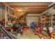 Garage filled with tools, lawnmowers, and miscellaneous items at 4800 Silverberry Nw Ln, Acworth, GA 30102