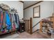 Hallway with a view of a staircase, lots of books, and a clothing rack at 4800 Silverberry Nw Ln, Acworth, GA 30102