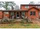Charming home featuring a covered porch with rocking chairs and a quaint, rustic appeal at 4800 Silverberry Nw Ln, Acworth, GA 30102