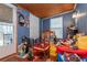 Sunroom with blue paneled walls and lots of personal items at 4800 Silverberry Nw Ln, Acworth, GA 30102
