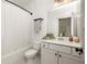 Clean bathroom boasts white vanity, shower/tub combo, and a mirror at 1196 Wylie Se St, Atlanta, GA 30316