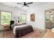 Inviting bedroom with ceiling fan, two windows, and decorative wall art at 1196 Wylie Se St, Atlanta, GA 30316