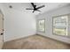 Bright bedroom with neutral walls, ceiling fan, and natural light from two windows at 1196 Wylie Se St, Atlanta, GA 30316