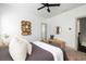 Bright bedroom features ceiling fan, decorative wall art, and neutral decor at 1196 Wylie Se St, Atlanta, GA 30316