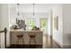 Bright kitchen features modern cabinets, stainless steel appliances, countertop seating and beautiful wood floors at 1196 Wylie Se St, Atlanta, GA 30316