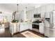 Well-lit kitchen with white cabinets, stainless steel appliances, and modern fixtures at 1196 Wylie Se St, Atlanta, GA 30316