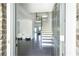 Inviting foyer with dark wood flooring, staircase and plenty of natural light at 2649 Ogden Trl, Buford, GA 30519