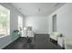 Bright home office space with a glass desk, natural light, and neutral decor at 2649 Ogden Trl, Buford, GA 30519