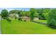 Expansive backyard view highlighting the property's large grassy area, fencing, and detached garage at 3332 Oak Grove Rd, Loganville, GA 30052