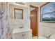 Traditional bathroom with vintage vanity, medicine cabinet, and tile flooring at 3332 Oak Grove Rd, Loganville, GA 30052