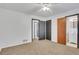 Large bedroom with carpet floors, neutral paint, and attached bathroom at 3332 Oak Grove Rd, Loganville, GA 30052