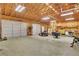 Spacious two car garage featuring high ceilings, lighting and dual overhead garage doors at 3332 Oak Grove Rd, Loganville, GA 30052