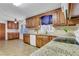 Well-equipped kitchen featuring granite countertops, wooden cabinets, and modern appliances at 3332 Oak Grove Rd, Loganville, GA 30052
