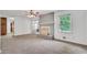 Comfortable living room with a fireplace, carpet, and natural light, creating a relaxing atmosphere at 3332 Oak Grove Rd, Loganville, GA 30052