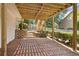 Backyard featuring a brick patio under the deck, stairs leading to the deck and landscaped yard at 11100 Chandon Way, Johns Creek, GA 30097