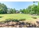 Expansive green space with trees, picnic tables, and recreational areas providing a serene outdoor experience at 11100 Chandon Way, Johns Creek, GA 30097