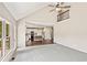 Open-concept living room with modern ceiling fan, views of the kitchen, and lots of light at 11100 Chandon Way, Johns Creek, GA 30097