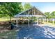 Covered picnic area with several picnic tables and barbeque grills for community gatherings and outdoor dining at 11100 Chandon Way, Johns Creek, GA 30097