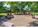 A well-equipped playground with slides, climbing frames, and a cushioned ground cover for safety at 11100 Chandon Way, Johns Creek, GA 30097