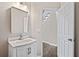 Bright powder room featuring a modern vanity, stylish mirror, and updated fixtures at 11100 Chandon Way, Johns Creek, GA 30097