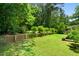 Expansive backyard featuring lush greenery and a well-manicured lawn, perfect for outdoor activities and relaxation at 1492 Sagewood Cir, Stone Mountain, GA 30083