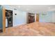 Finished basement featuring tile floors, a storage cabinet, and two doorways at 1492 Sagewood Cir, Stone Mountain, GA 30083
