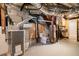 Unfinished basement utility area with furnace, hot water heater and toilet at 1492 Sagewood Cir, Stone Mountain, GA 30083