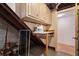 Basement utility area with shelving and crawl space access at 1492 Sagewood Cir, Stone Mountain, GA 30083