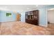 Finished basement featuring tile floors, a storage cabinet, and a window at 1492 Sagewood Cir, Stone Mountain, GA 30083
