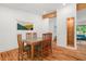 Charming dining area with hardwood floors, a unique wooden table, and an open space design at 1492 Sagewood Cir, Stone Mountain, GA 30083