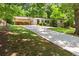 Attractive single-story home with carport and well-maintained front lawn at 1492 Sagewood Cir, Stone Mountain, GA 30083