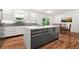 Modern kitchen features a large island, sleek cabinetry, and stainless appliances at 1492 Sagewood Cir, Stone Mountain, GA 30083