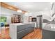 Spacious kitchen boasts an island with a sleek marble countertop, modern lighting, and stainless steel appliances at 1492 Sagewood Cir, Stone Mountain, GA 30083