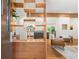 Bright entryway featuring a wooden bookshelf and hardwood floors throughout at 1492 Sagewood Cir, Stone Mountain, GA 30083