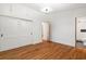 Bedroom with hardwood floors, closet and bathroom access featuring storage space at 1492 Sagewood Cir, Stone Mountain, GA 30083