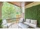 Comfortable back porch features a glass table, outdoor seating and green foliage at 4228 Laurel Creek Se Ct # 6, Smyrna, GA 30080