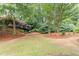 Lush backyard featuring mature trees and well-manicured landscaping at 4228 Laurel Creek Se Ct # 6, Smyrna, GA 30080